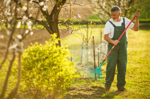 Team preparing garden tools before a clearance job